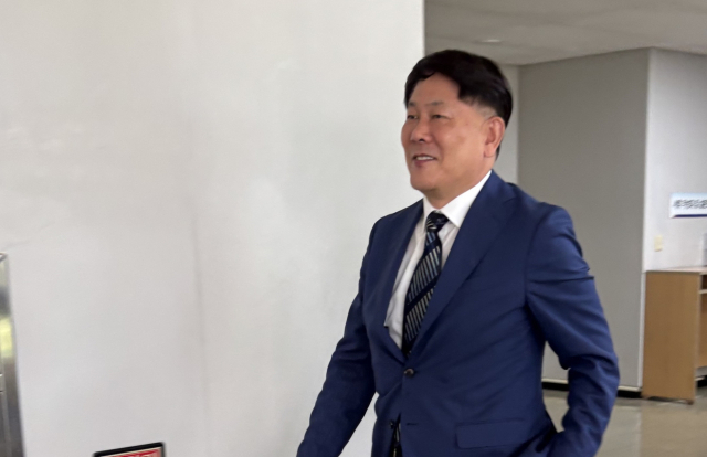 23일 항소 선고심에서 출석하는 김정규 타이어뱅크 회장. 사진=김중곤 기자